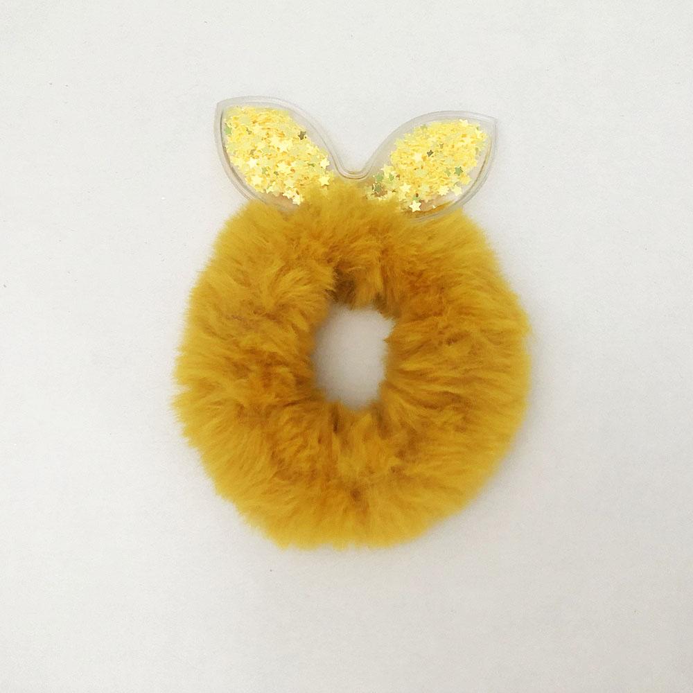 Гумки для волосся хутряні з блискітками всередині вушок. Колір жовтий